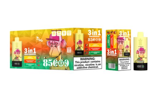 A display box and individual vape pens labeled '3 in 1' featuring a cartoon monkey character wearing a pink hat, with flavors like Berry Lemonade, Strawberry Red Bull, and Strawberry Pomp, alongside warning statements about nicotine.