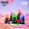 Five colorful BANG Leader Stoll vape bottles are arranged on circular pedestals against a surreal landscape with pink foliage and a gradient sky, each featuring distinctive artwork of bears and vibrant caps in yellow, green, pink, red, and blue along with a prominent '120000' in ornate typography.